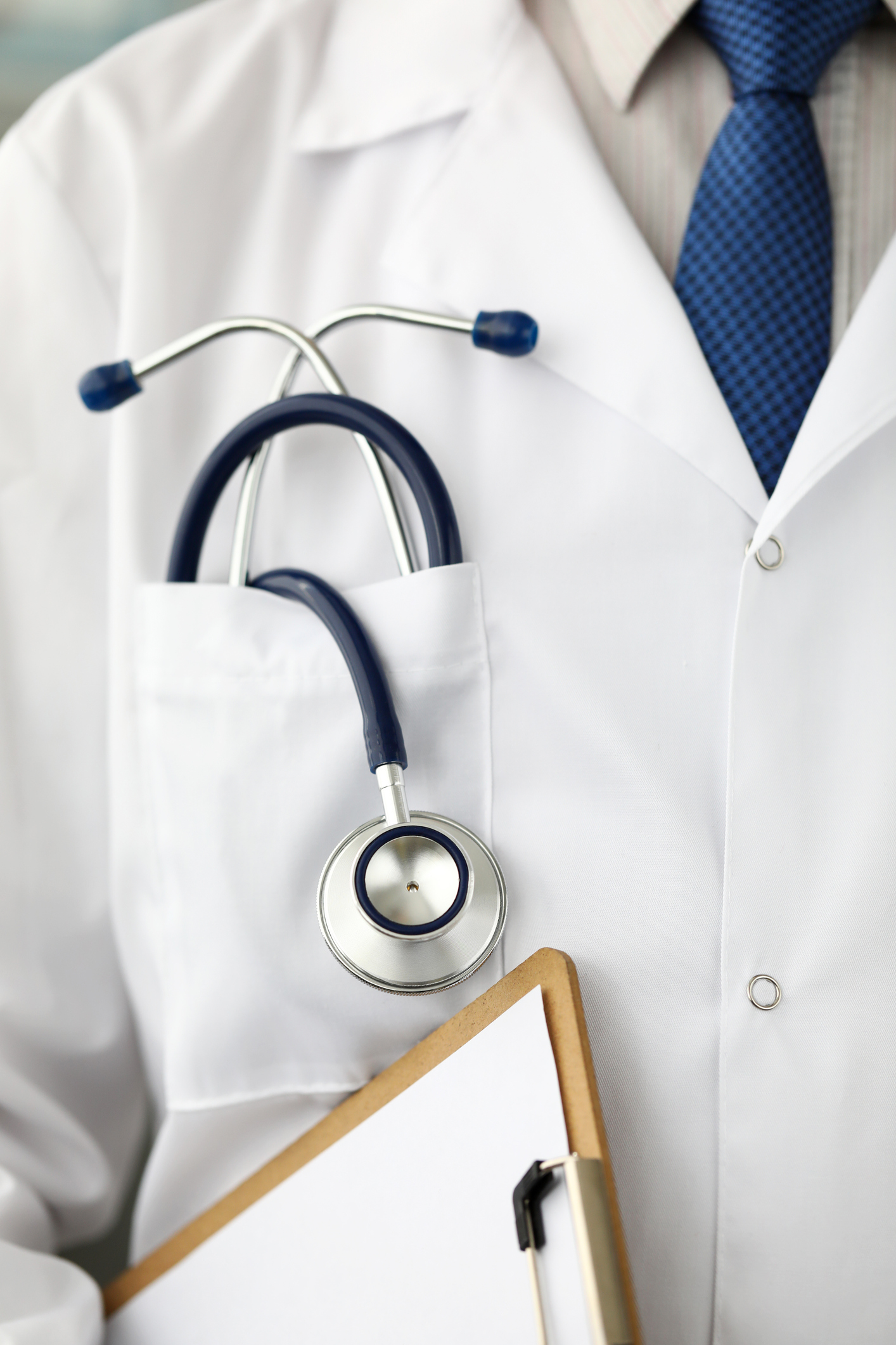 Partial view of a doctor with notepad