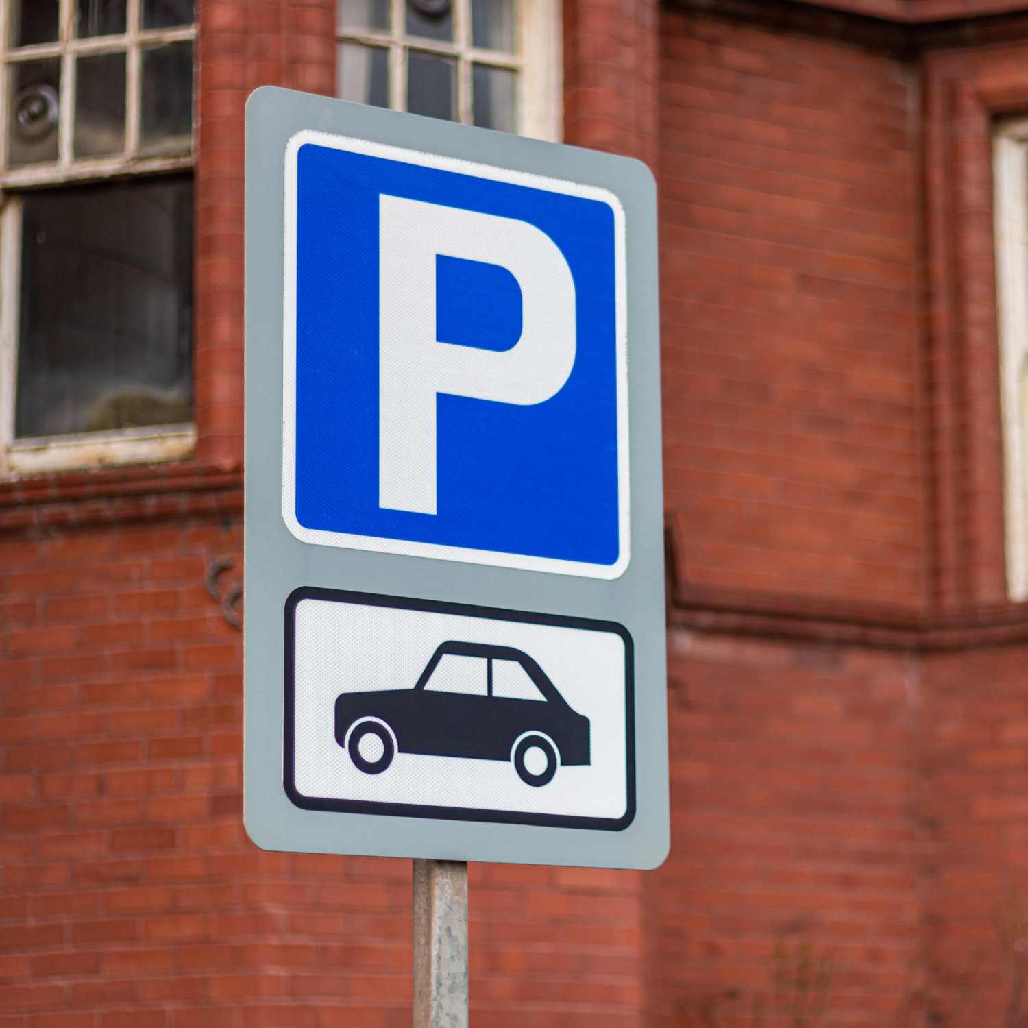 Parking signal board displaying clear directional guidance for vehicles within hospital premises