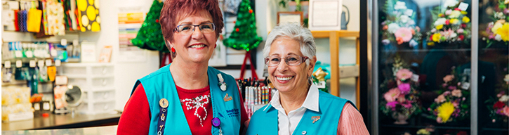 AP Volunteer Banner with two women in a store background well-uniformed