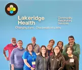 CRS staff group photo with team members dressed uniformly in professional attire