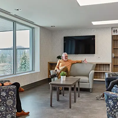 Well-organized activity space with three individuals engaged in focused discussion