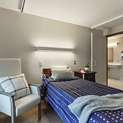 Bedroom shown from alternate angle, highlighting clean, organized, and modern furnishings